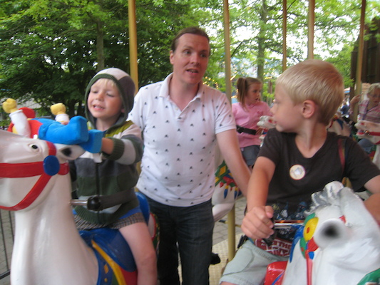 Cole, Ben and Tim on a merry-go-round (07-22-2009 16:33)
