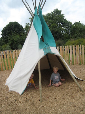 Tim and Cole in a wigwam at the Princess Diana playground (07-26-2009 14:46)