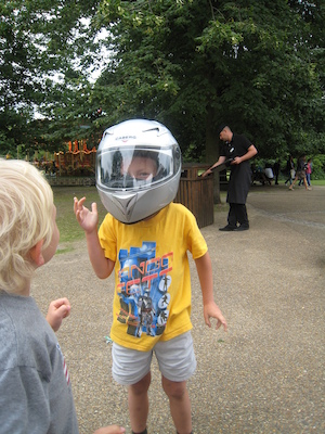 Cole and Tim with a motorcycle helmet on (07-26-2009 15:18)