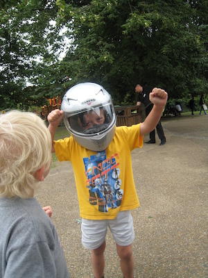 Cole and Tim with a motorcycle helmet on (07-26-2009 15:18)