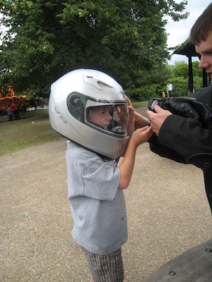 Cole with a motorcycle helmet on with Johnny (07-26-2009 15:18)