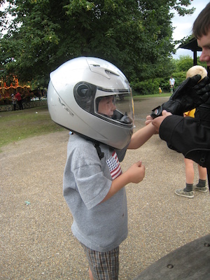 Cole with a motorcycle helmet on with Johnny and Tim (07-26-2009 15:18)