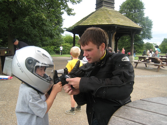Cole with a motorcycle helmet on with Johnny and Tim (07-26-2009 15:18)