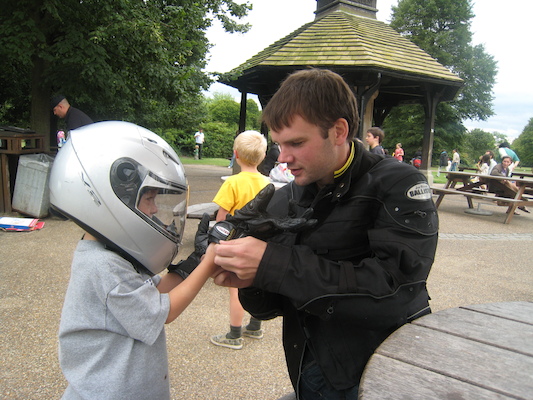 Cole with a motorcycle helmet on with Johnny and Tim (07-26-2009 15:18)