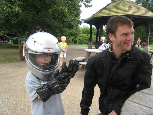 Cole with a motorcycle helmet on with Johnny and Tim (07-26-2009 15:19)