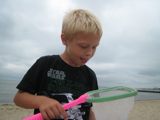 Tim examining his catch (08-12-2009 09:53)