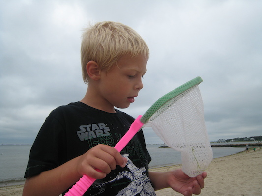Tim examining his catch (08-12-2009 09:54)