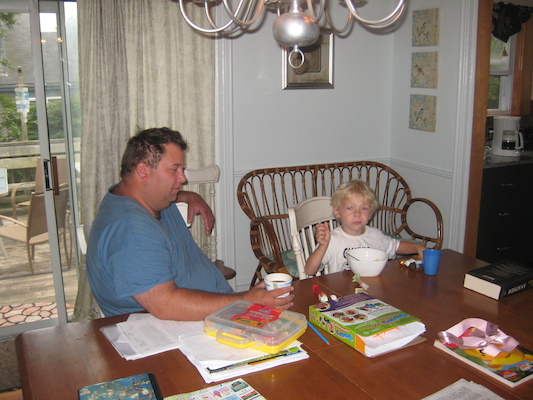 Matt and Cole at breakfast (08-15-2009 06:06)