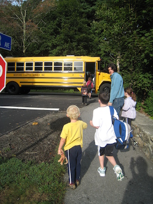 Tim getting on the bus while Cole watches (09-14-2009 07:41)