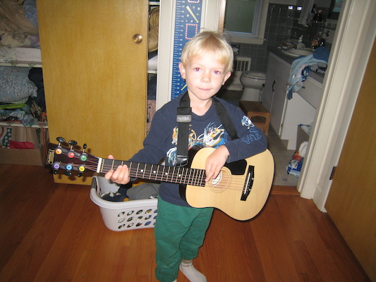 Cole playing guitar (10-06-2009 07:03)