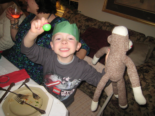 Cole with his "dreidel" and sock monkey (12-25-2009 17:55)