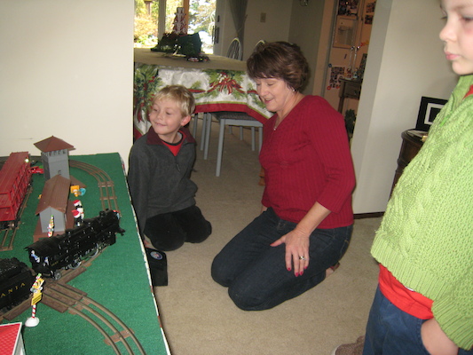 Patti, Tim and Cole playing trains (12-26-2009 13:09)