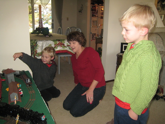 Patti, Tim and Cole playing trains (12-26-2009 13:09)