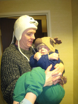 Ben carrying a sleeping Cole (12-27-2009 19:35)