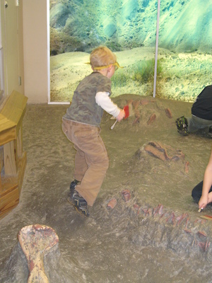 Cole excavating a dinosaur (12-30-2009 11:47)
