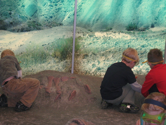 Cole and Tim excavating a dinosaur (12-30-2009 11:47)
