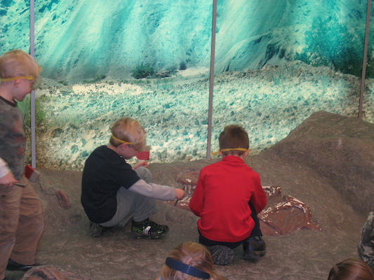 Cole and Tim excavating a dinosaur (12-30-2009 11:47)