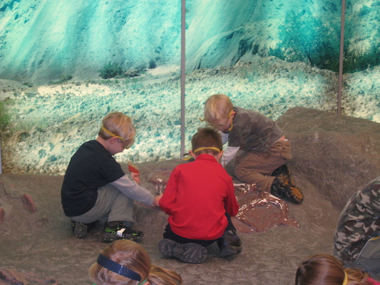 Cole and Tim excavating a dinosaur (12-30-2009 11:47)