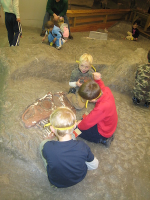 Cole and Tim excavating a dinosaur (12-30-2009 11:48)