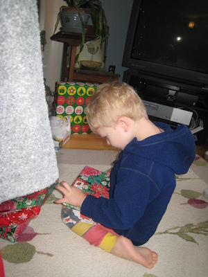 Cole unwrapping a present (01-01-2010 08:06)