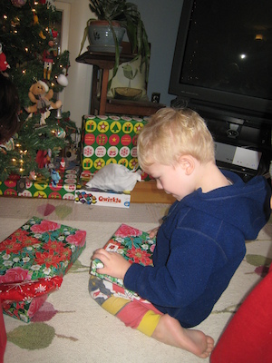 Cole unwrapping a present (01-01-2010 08:06)
