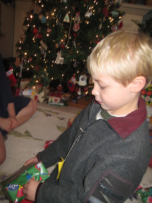 Tim unwrapping a present (01-01-2010 08:07)