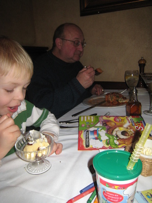 Cole and Poppy eating dessert (03-01-2010 17:56)
