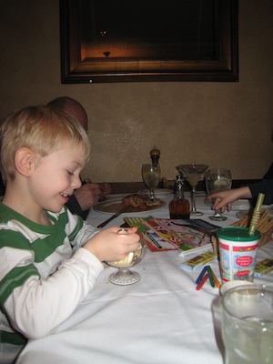 Cole and Poppy eating dessert (03-01-2010 17:56)