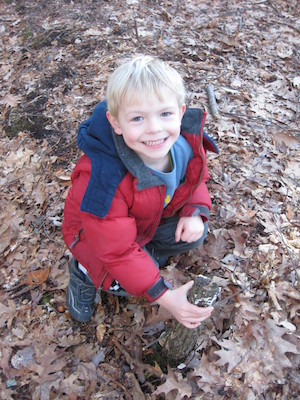 Cole examining a beaver's work at Fawn lake (03-05-2010 20:59)