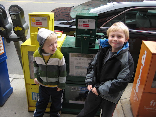 Cole and Tim by a newspaper box (03-12-2010 14:49)