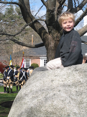 Tim on a rock with revolutionaries (04-10-2010 09:21)