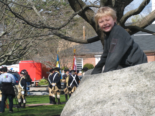 Tim on a rock with revolutionaries (04-10-2010 09:21)