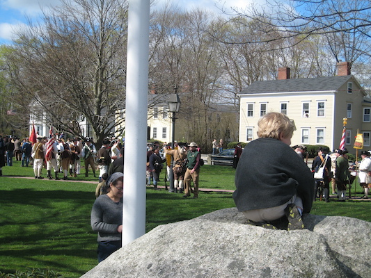 Tim on a rock with revolutionaries (04-10-2010 09:22)
