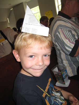 Cole and Poppy with a paper hat (06-06-2010 09:43)