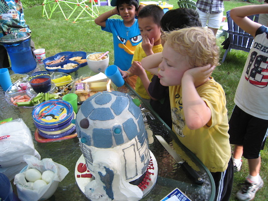 Cole blowing out the candle (06-20-2010 16:39)