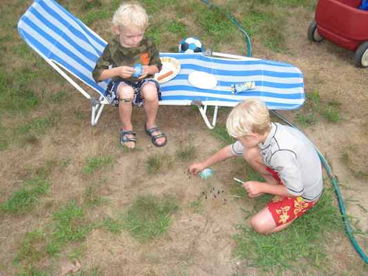 Cole and Tim building a beach at the Tatroe's party (07-17-2010 18:28)