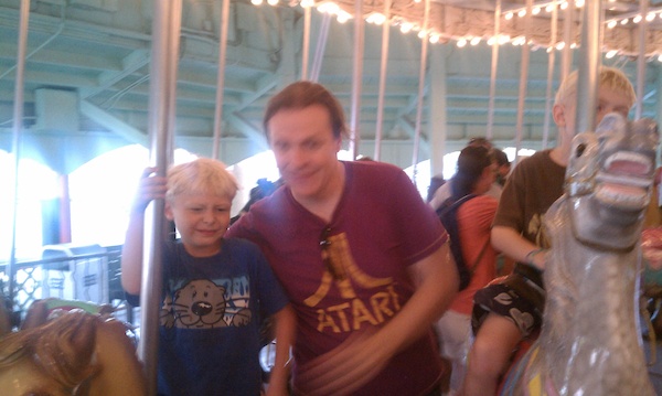 Tim, Ben and Cole on the merry-go-round (08-15-2010 18:51)