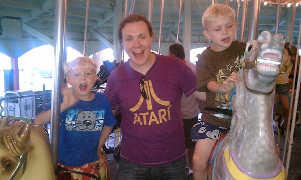 Tim, Ben and Cole on the merry-go-round (08-15-2010 18:51)