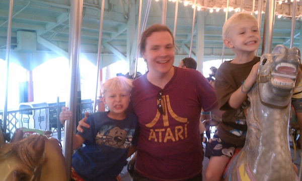 Tim, Ben and Cole on the merry-go-round (08-15-2010 18:51)