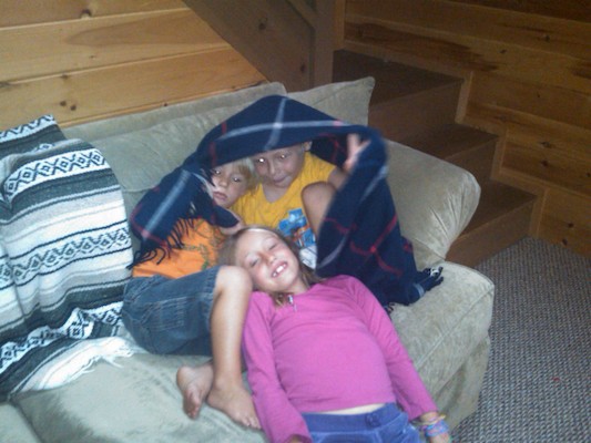 Linnea, Solomon, and Tim cuddling (08-23-2010 07:49)