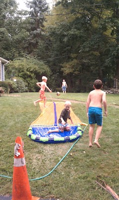 Tim, Cole, Gavin and Michael slip-n-sliding (09-07-2010 16:26)
