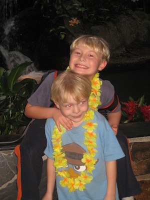 Tim and Cole with leis at the Polynesian (02-26-2011 14:00)