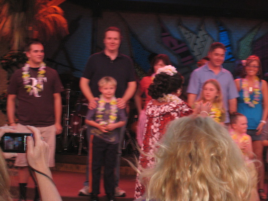 Tim and Ben celebrating their birthdays at the luau (02-26-2011 18:13)