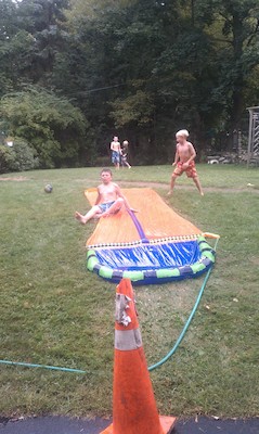 Tim and Cole slip and slide with the neighbors (09-07-2010 16:27)