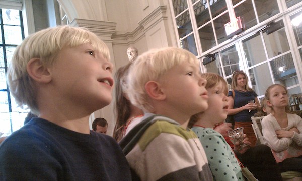 Tim and Cole watching puppets at the Athenaeum (10-16-2010 12:03)