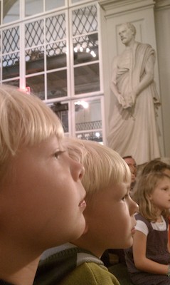 Tim and Cole watching puppets at the Athenaeum (10-16-2010 12:04)