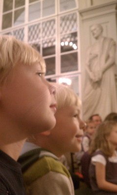 Tim and Cole watching puppets at the Athenaeum (10-16-2010 12:05)