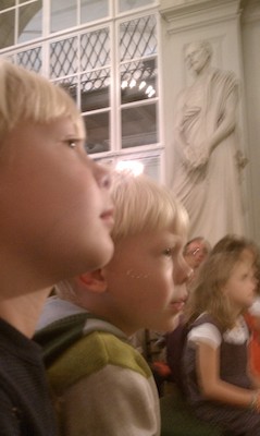 Tim and Cole watching puppets at the Athenaeum (10-16-2010 12:05)