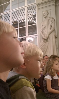 Tim and Cole watching puppets at the Athenaeum (10-16-2010 12:05)