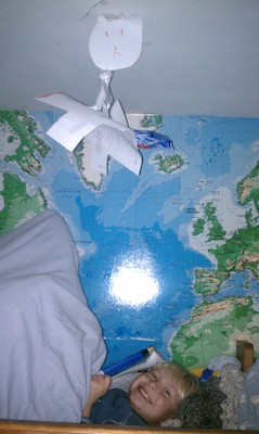 Tim reading in bed (11-28-2010 20:19)